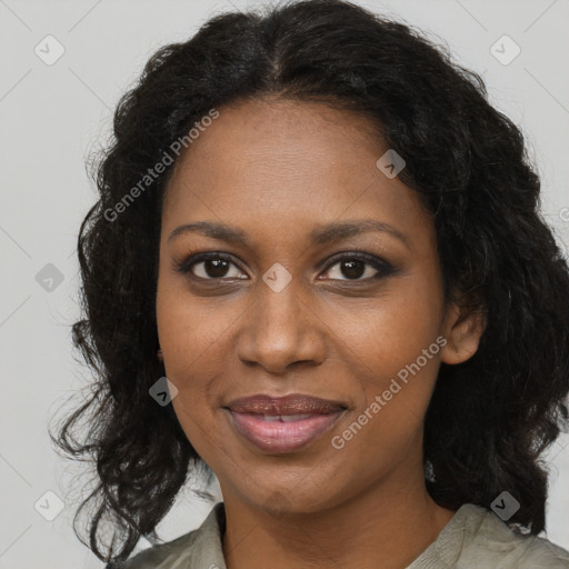 Joyful black adult female with medium  brown hair and brown eyes