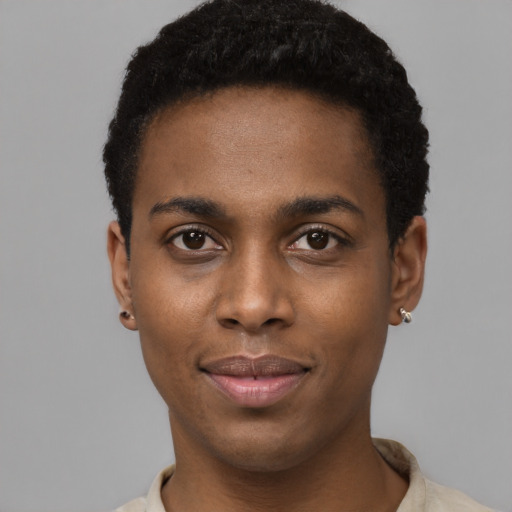 Joyful black young-adult male with short  black hair and brown eyes