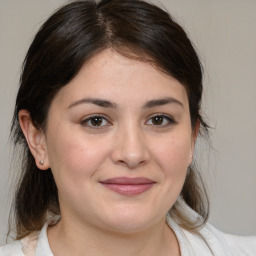 Joyful white young-adult female with medium  brown hair and brown eyes