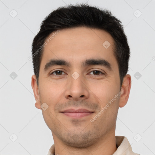 Joyful white young-adult male with short  black hair and brown eyes