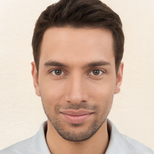 Joyful white young-adult male with short  brown hair and brown eyes