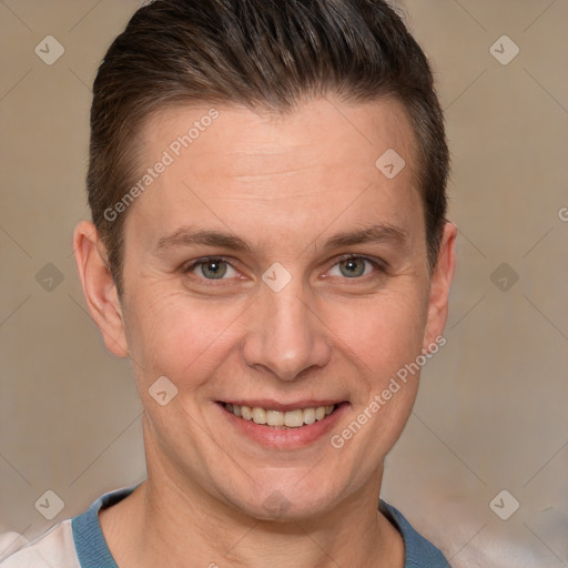 Joyful white adult male with short  brown hair and brown eyes