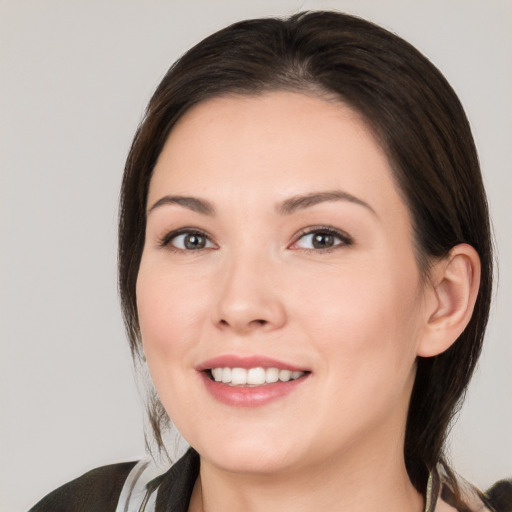 Joyful white young-adult female with medium  brown hair and brown eyes