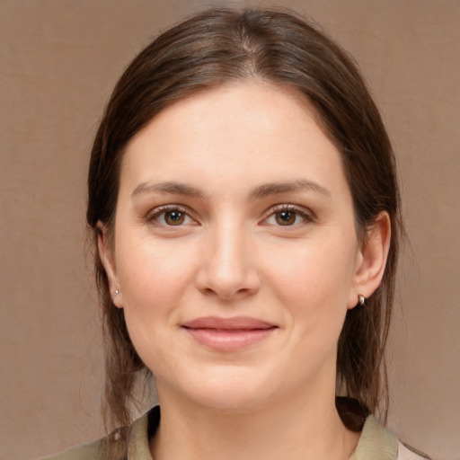 Joyful white young-adult female with medium  brown hair and brown eyes