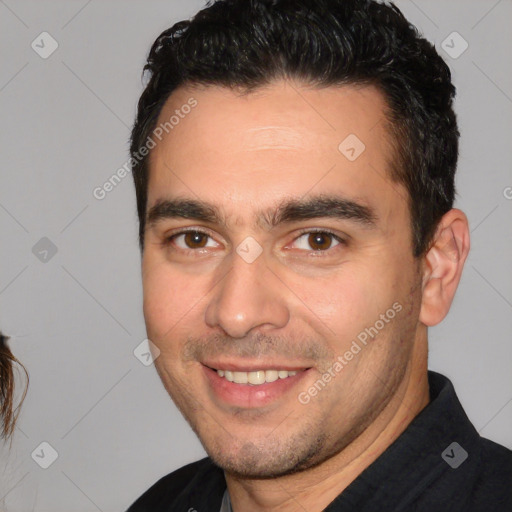 Joyful white young-adult male with short  black hair and brown eyes