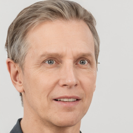 Joyful white adult male with short  brown hair and grey eyes