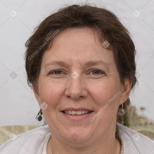 Joyful white adult female with short  brown hair and brown eyes