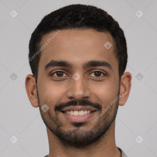 Joyful latino young-adult male with short  black hair and brown eyes