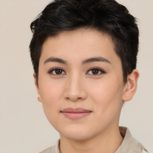 Joyful asian young-adult female with short  brown hair and brown eyes