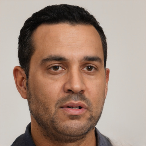 Neutral white adult male with short  black hair and brown eyes