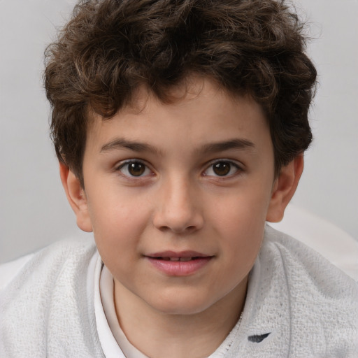 Joyful white child male with short  brown hair and brown eyes