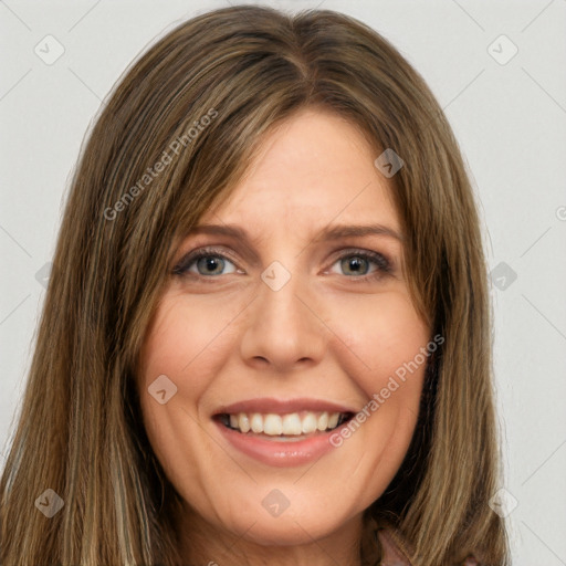 Joyful white young-adult female with long  brown hair and green eyes