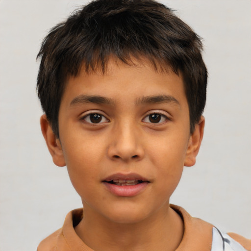 Joyful white child male with short  brown hair and brown eyes