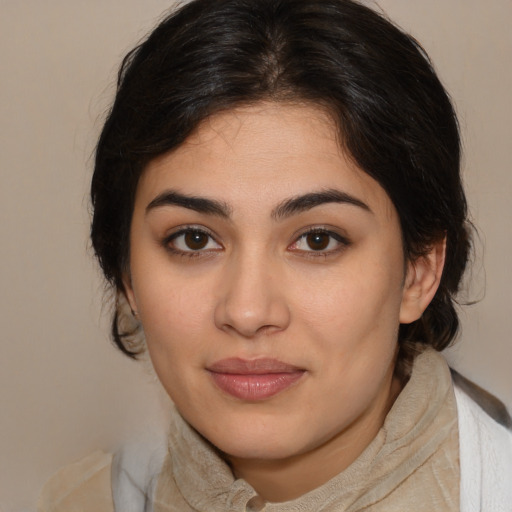 Joyful latino young-adult female with medium  brown hair and brown eyes