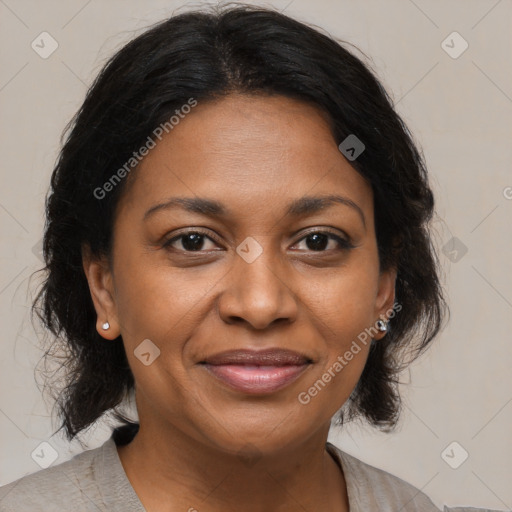 Joyful black adult female with medium  brown hair and brown eyes