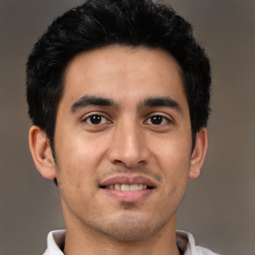 Joyful asian young-adult male with short  brown hair and brown eyes