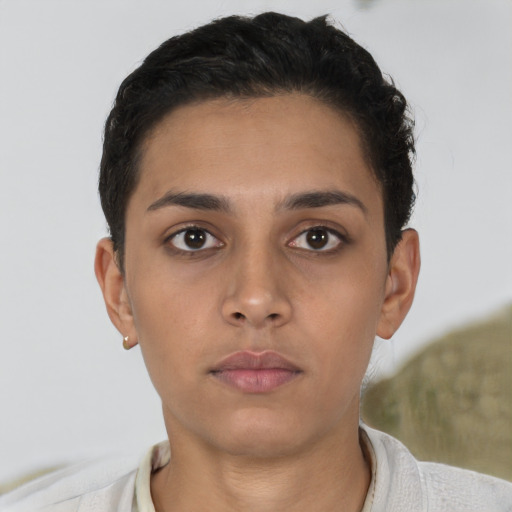 Neutral latino young-adult female with short  brown hair and brown eyes