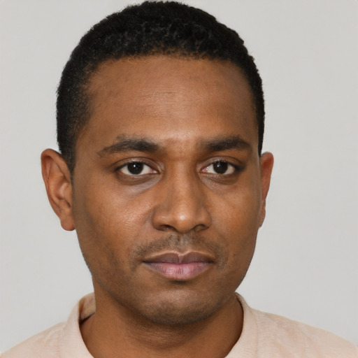 Neutral black young-adult male with short  black hair and brown eyes