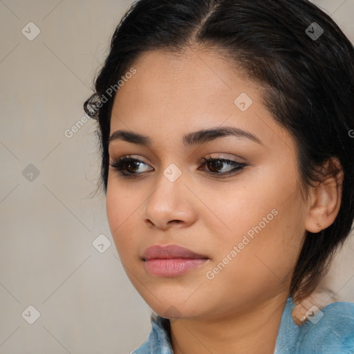 Joyful latino young-adult female with medium  brown hair and brown eyes