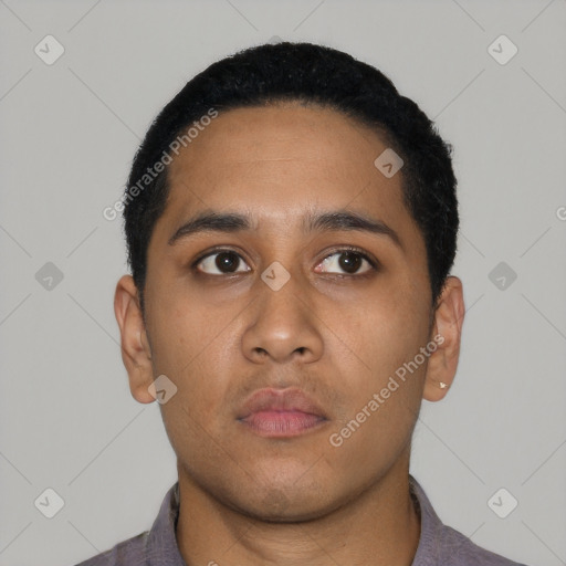 Neutral latino young-adult male with short  black hair and brown eyes