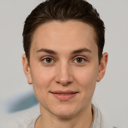 Joyful white young-adult female with short  brown hair and brown eyes