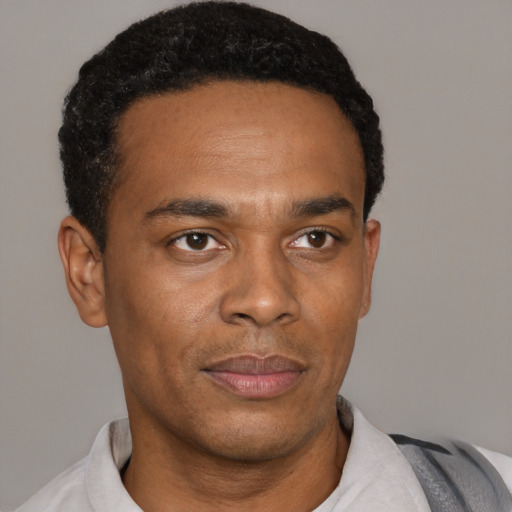 Neutral black young-adult male with short  black hair and brown eyes