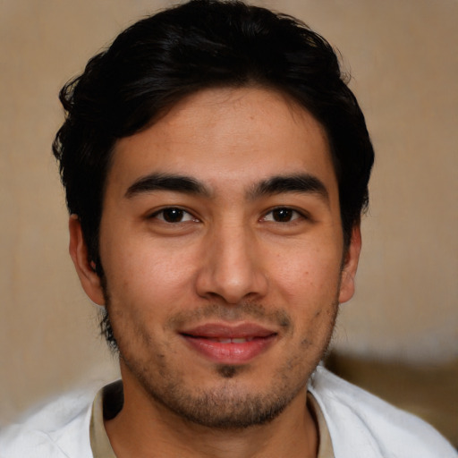 Joyful asian young-adult male with short  brown hair and brown eyes