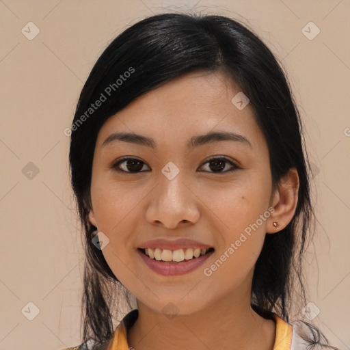 Joyful asian young-adult female with long  black hair and brown eyes