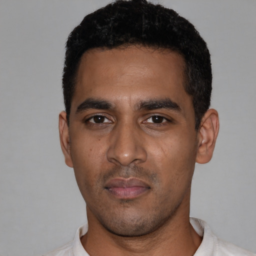 Neutral latino young-adult male with short  black hair and brown eyes