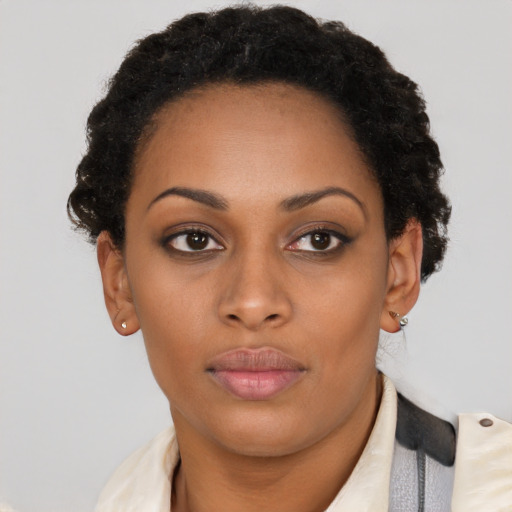 Neutral black young-adult female with short  brown hair and brown eyes