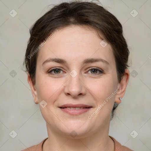 Joyful white young-adult female with medium  brown hair and grey eyes