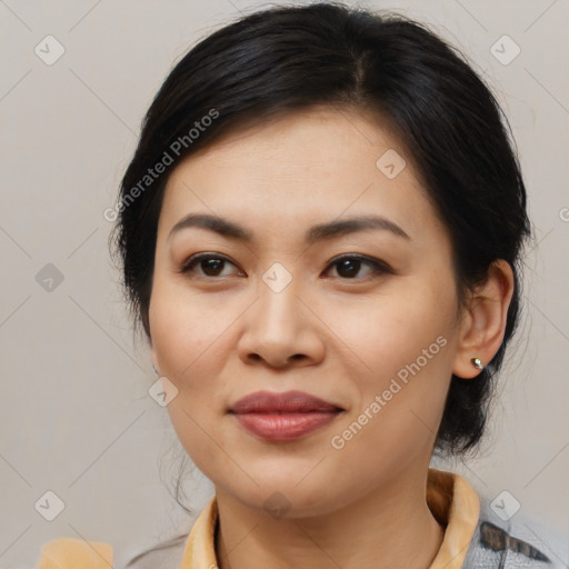 Joyful asian young-adult female with medium  brown hair and brown eyes