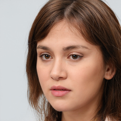 Neutral white young-adult female with medium  brown hair and brown eyes