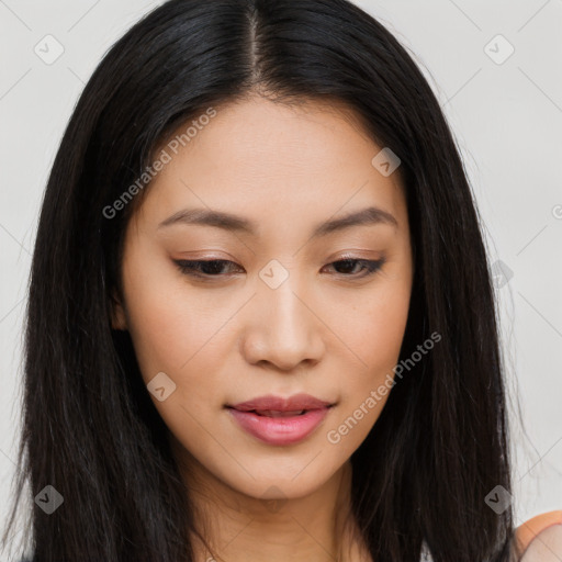 Joyful asian young-adult female with long  brown hair and brown eyes