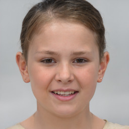 Joyful white child female with short  brown hair and brown eyes