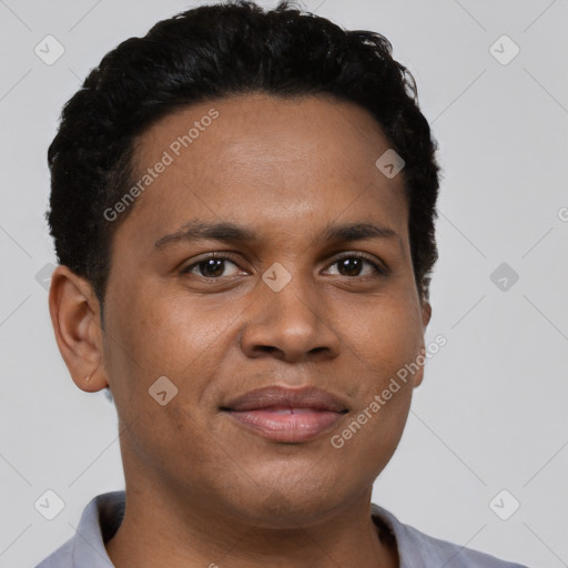 Joyful black young-adult male with short  brown hair and brown eyes