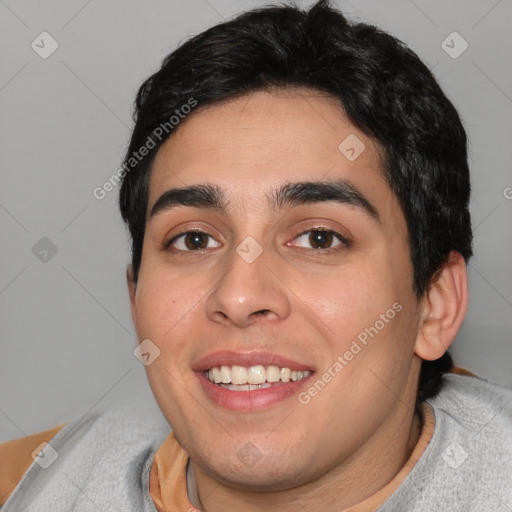 Joyful white young-adult male with short  black hair and brown eyes