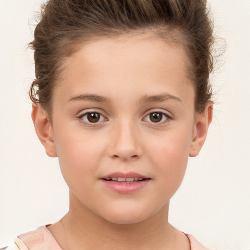 Joyful white child female with short  brown hair and brown eyes