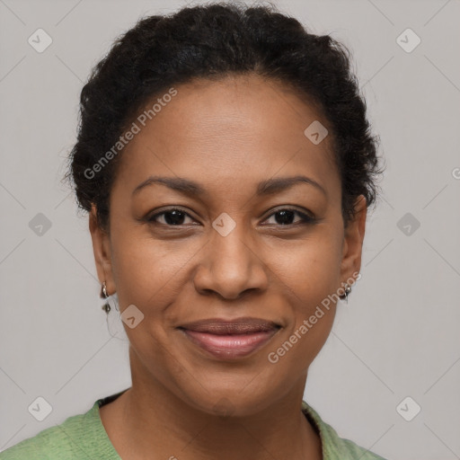 Joyful black adult female with short  brown hair and brown eyes