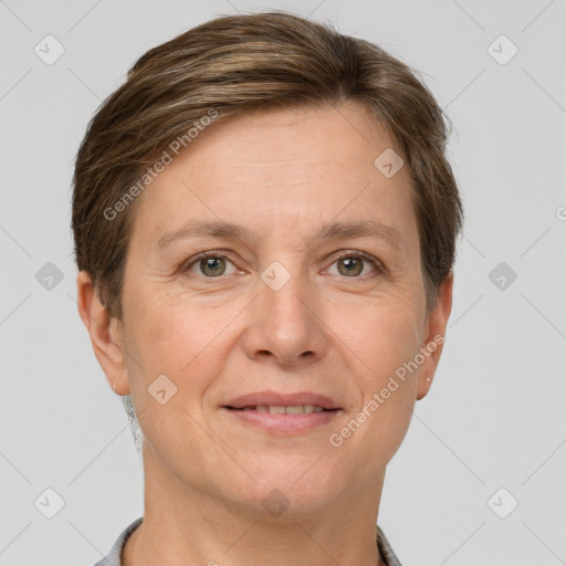 Joyful white adult female with short  brown hair and grey eyes