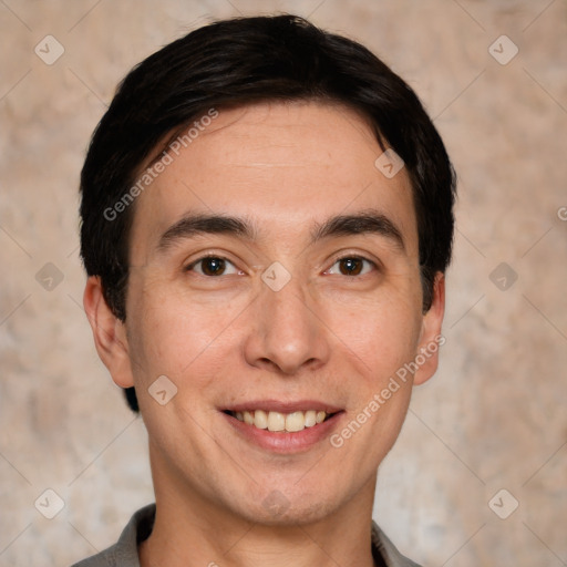 Joyful white adult male with short  black hair and brown eyes