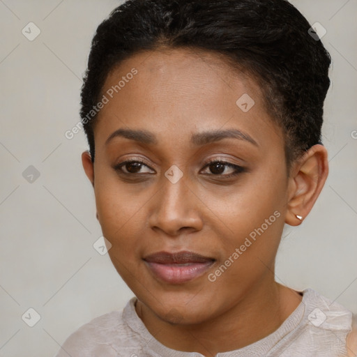 Joyful black young-adult female with short  brown hair and brown eyes