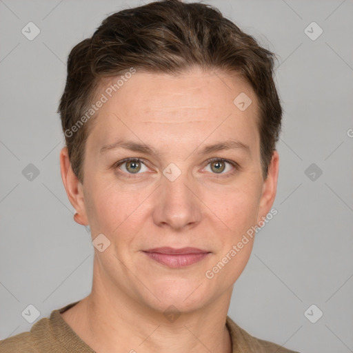 Joyful white adult female with short  brown hair and grey eyes