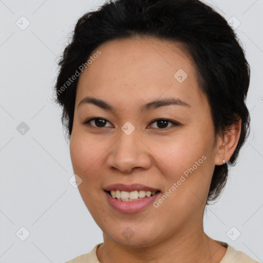 Joyful latino young-adult female with short  brown hair and brown eyes