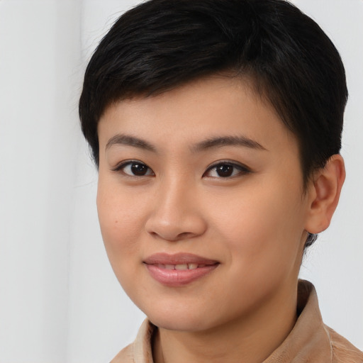 Joyful latino young-adult female with short  brown hair and brown eyes