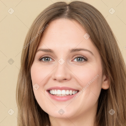 Joyful white young-adult female with long  brown hair and green eyes