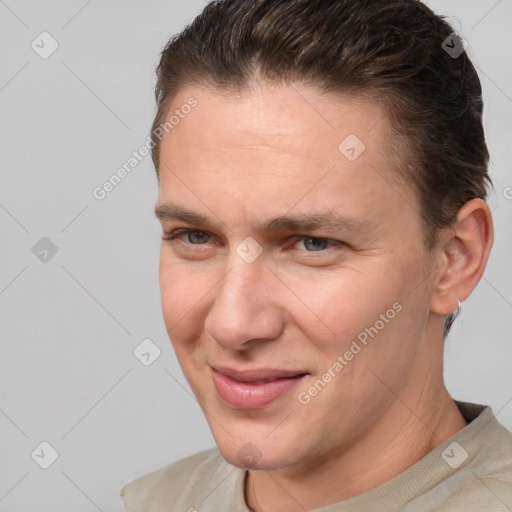 Joyful white adult male with short  brown hair and brown eyes