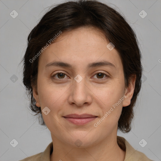 Joyful white adult female with medium  brown hair and brown eyes