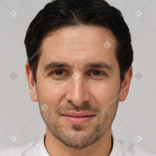 Joyful white adult male with short  brown hair and brown eyes