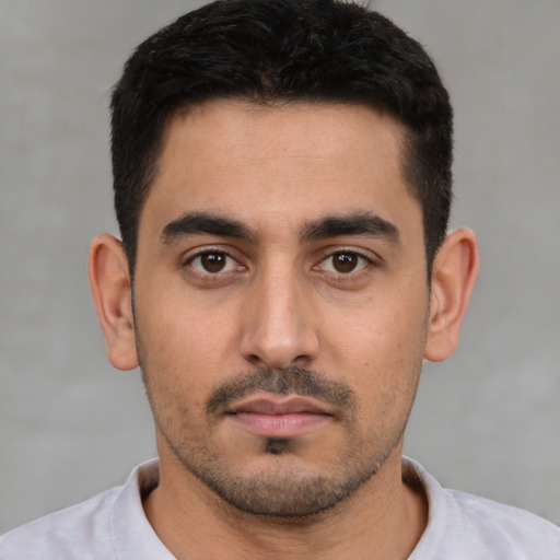 Neutral white young-adult male with short  black hair and brown eyes